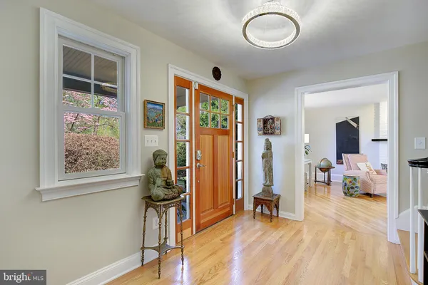 a kitchen with stainless steel appliances kitchen island granite countertop a refrigerator and a stove top oven