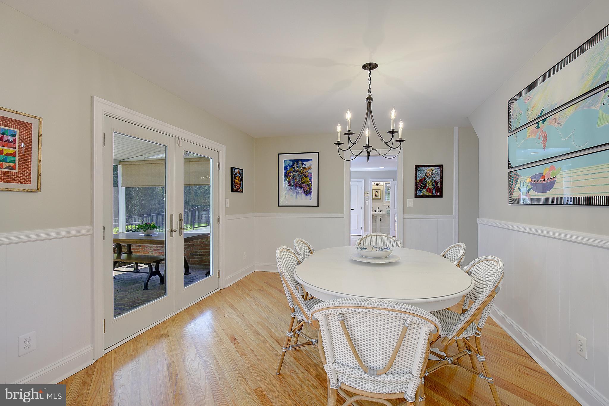 2 Isaacs Street Annapolis, MD 21401 - Photo 31 of 63 a dining room with chandelier and wooden floor
