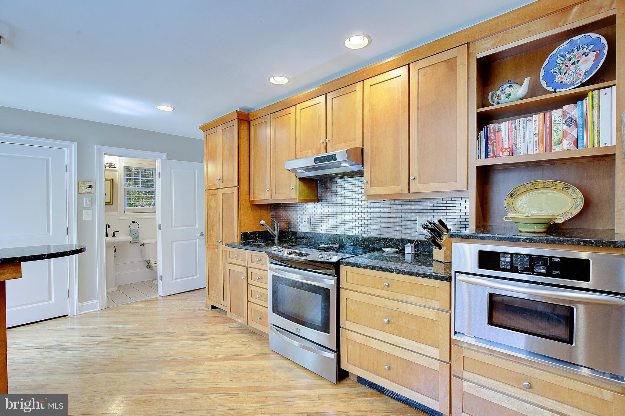 2 Isaacs Street Annapolis, MD 21401 - Photo 36 of 63 a kitchen with stainless steel appliances granite countertop a stove and a refrigerator