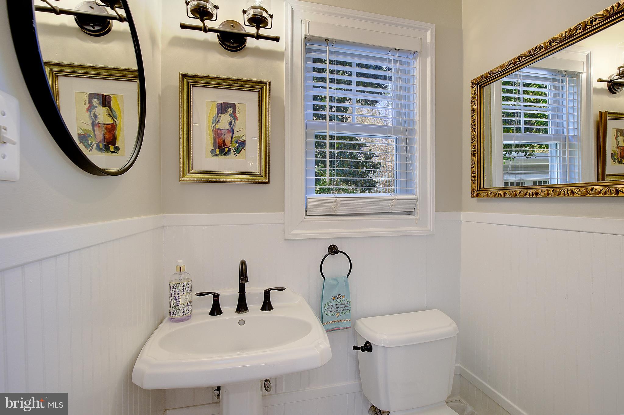 2 Isaacs Street Annapolis, MD 21401 - Photo 38 of 63 a bathroom with a toilet a sink and a mirror