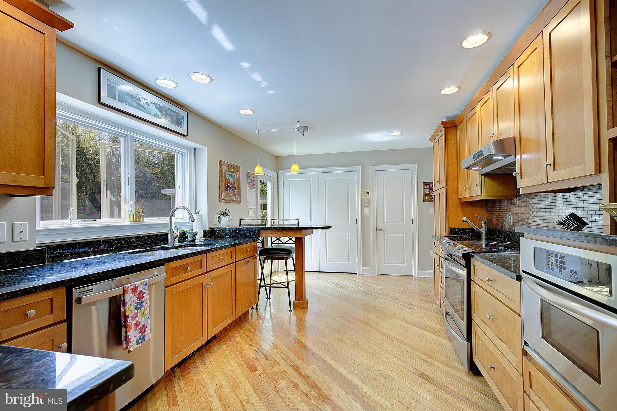 2 Isaacs Street Annapolis, MD 21401 - Photo 43 of 63 a kitchen with stainless steel appliances granite countertop sink stove top oven and cabinets