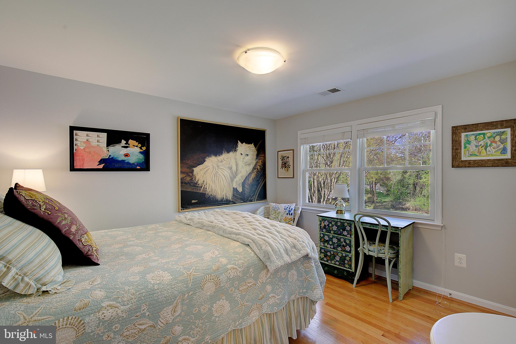 2 Isaacs Street Annapolis, MD 21401 - Photo 56 of 63 a bedroom with a bed and a table in it
