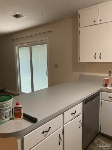 a utility room with sink dryer and washer