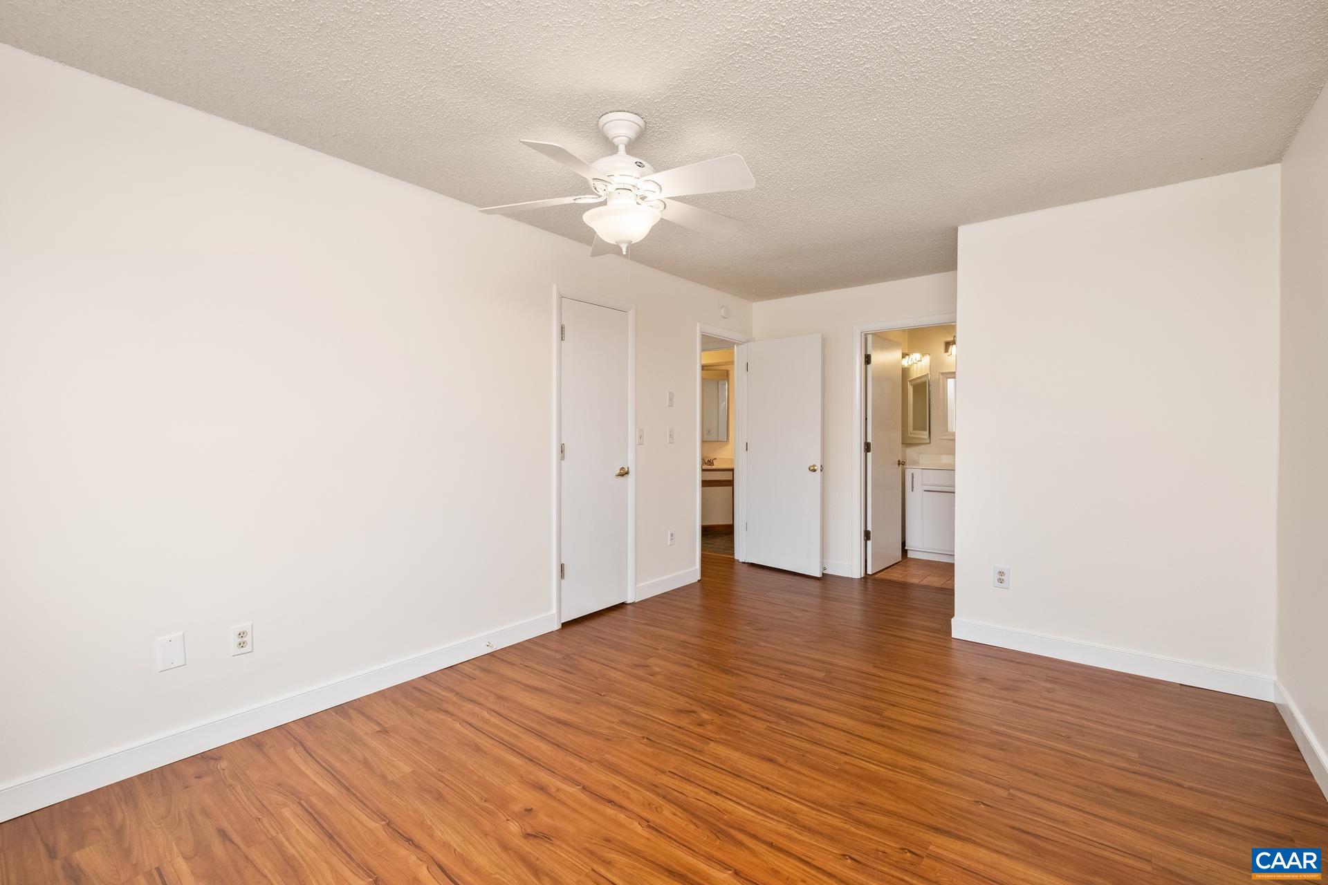103 Turtle Creek Road, Unit 2 Charlottesville, VA 22901 - Photo 11 of 24 a view of an empty room with wooden floor