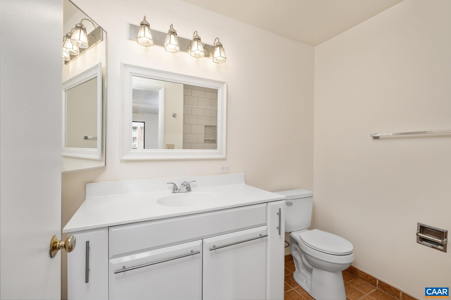 103 Turtle Creek Road, Unit 2 Charlottesville, VA 22901 - Photo 13 of 24 a bathroom with a sink toilet and vanity
