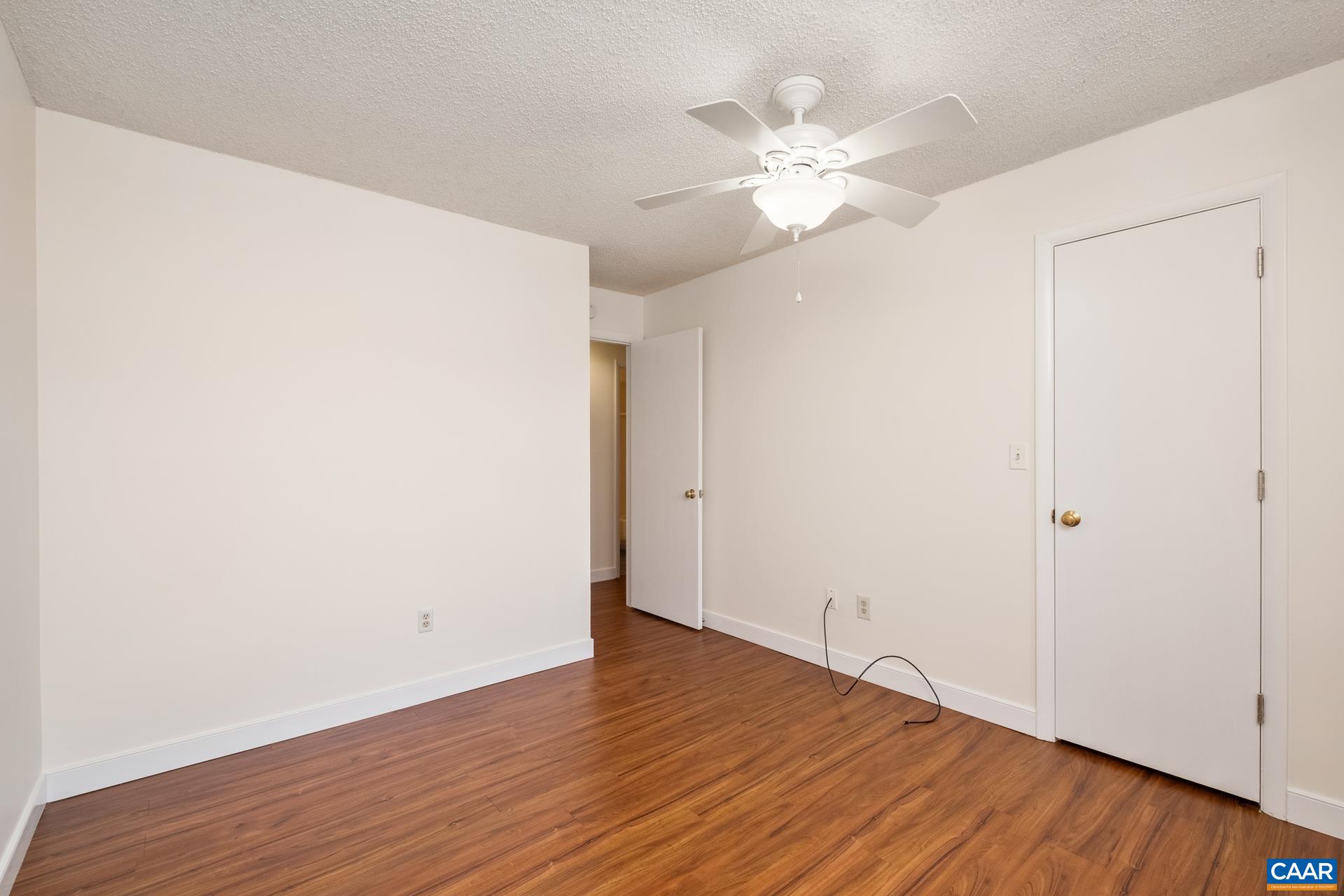 103 Turtle Creek Road, Unit 2 Charlottesville, VA 22901 - Photo 16 of 24 a view of an empty room with wooden floor