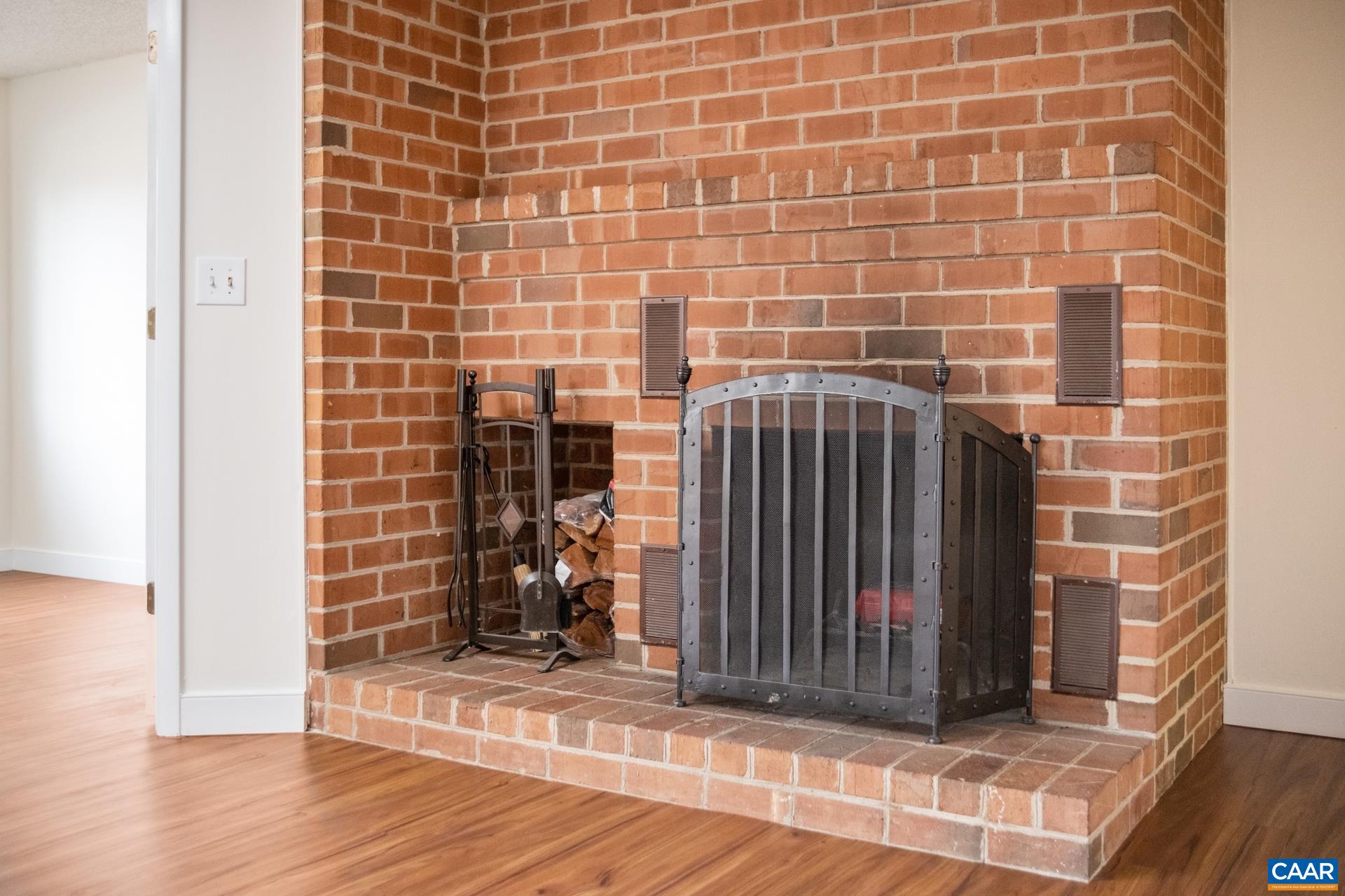 103 Turtle Creek Road, Unit 2 Charlottesville, VA 22901 - Photo 5 of 24 a view of a brick buildings with wooden floor