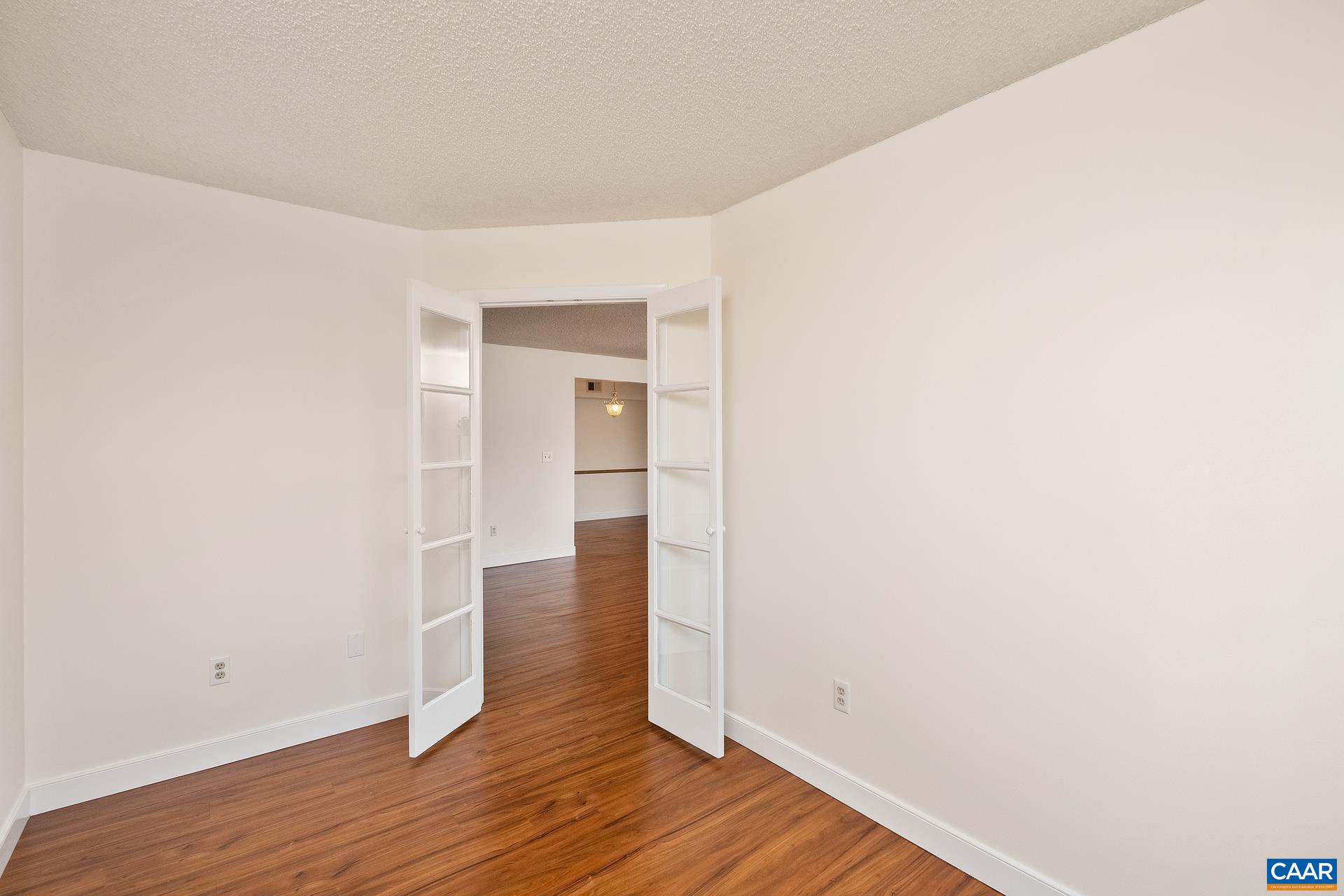 103 Turtle Creek Road, Unit 2 Charlottesville, VA 22901 - Photo 10 of 24 a view of empty room with wooden floor