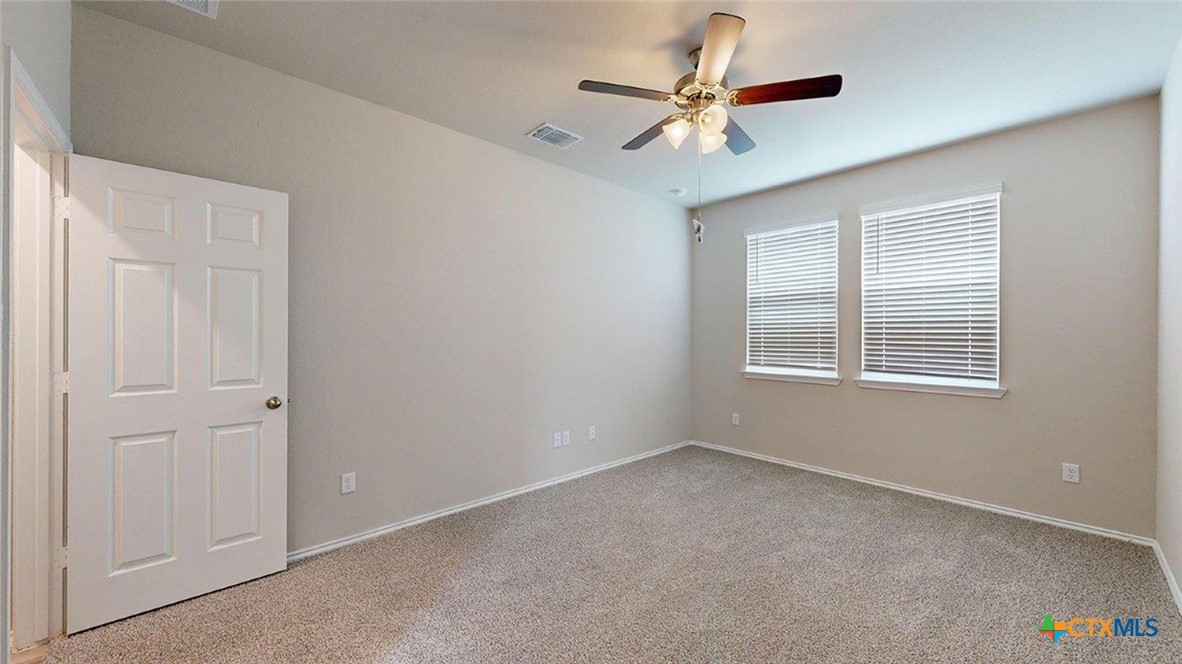 1111 Stone Vly Road Temple, TX 76502 - Photo 17 of 21 a view of a livingroom with a ceiling fan and window