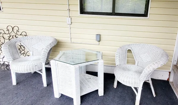 a view of balcony with furniture