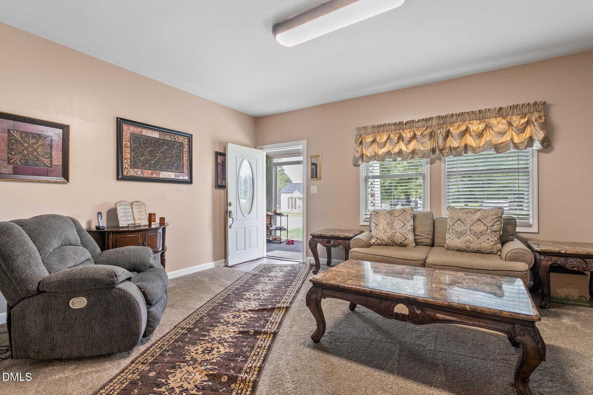 3163 Saul Loop Road Elon, NC 27244 - Photo 8 of 44 a living room with furniture and a large window