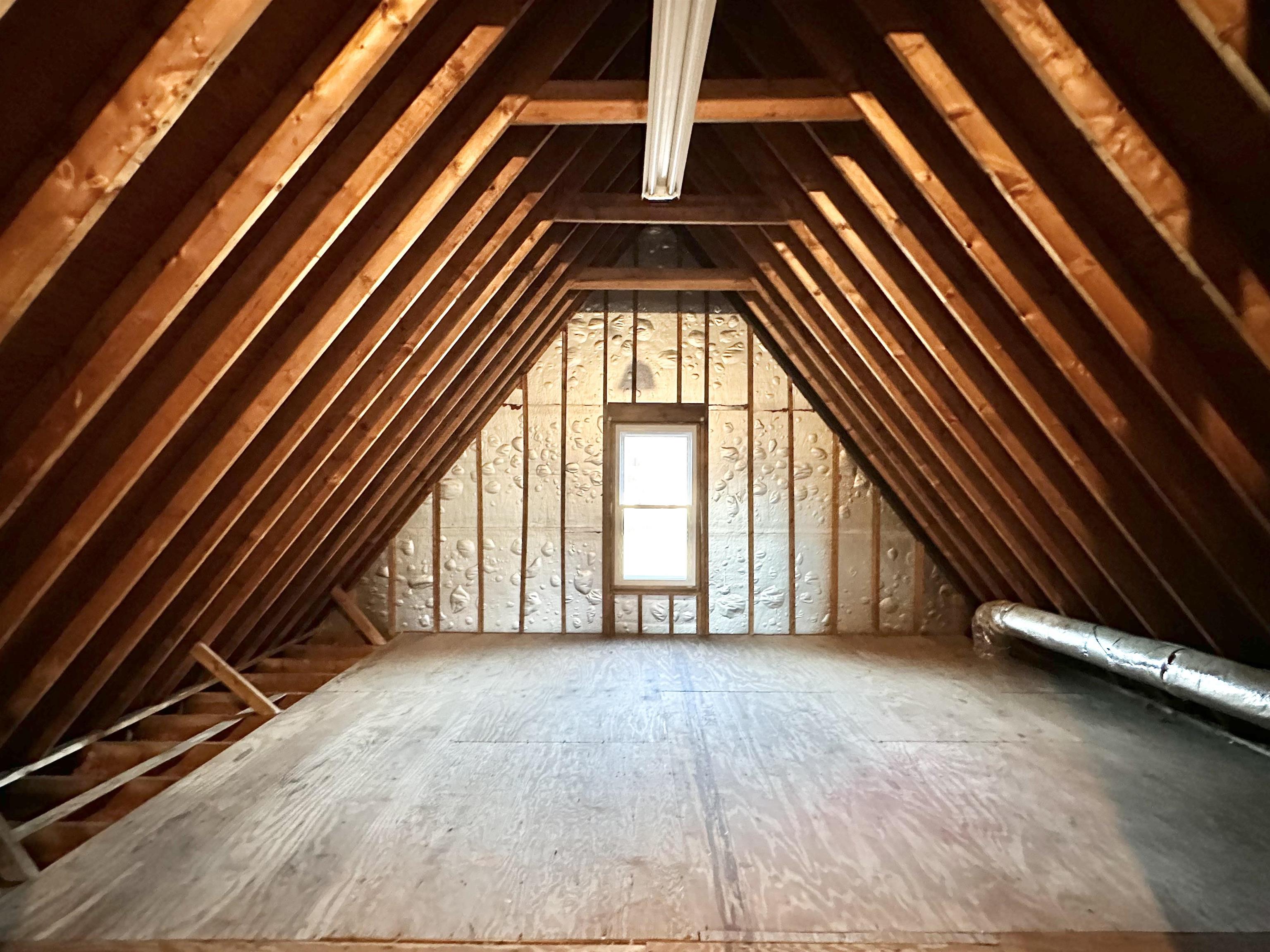 7475 Kingsland Drive Memphis, TN 38125 - Photo 24 of 32 a view of an empty room with wooden floor and a window