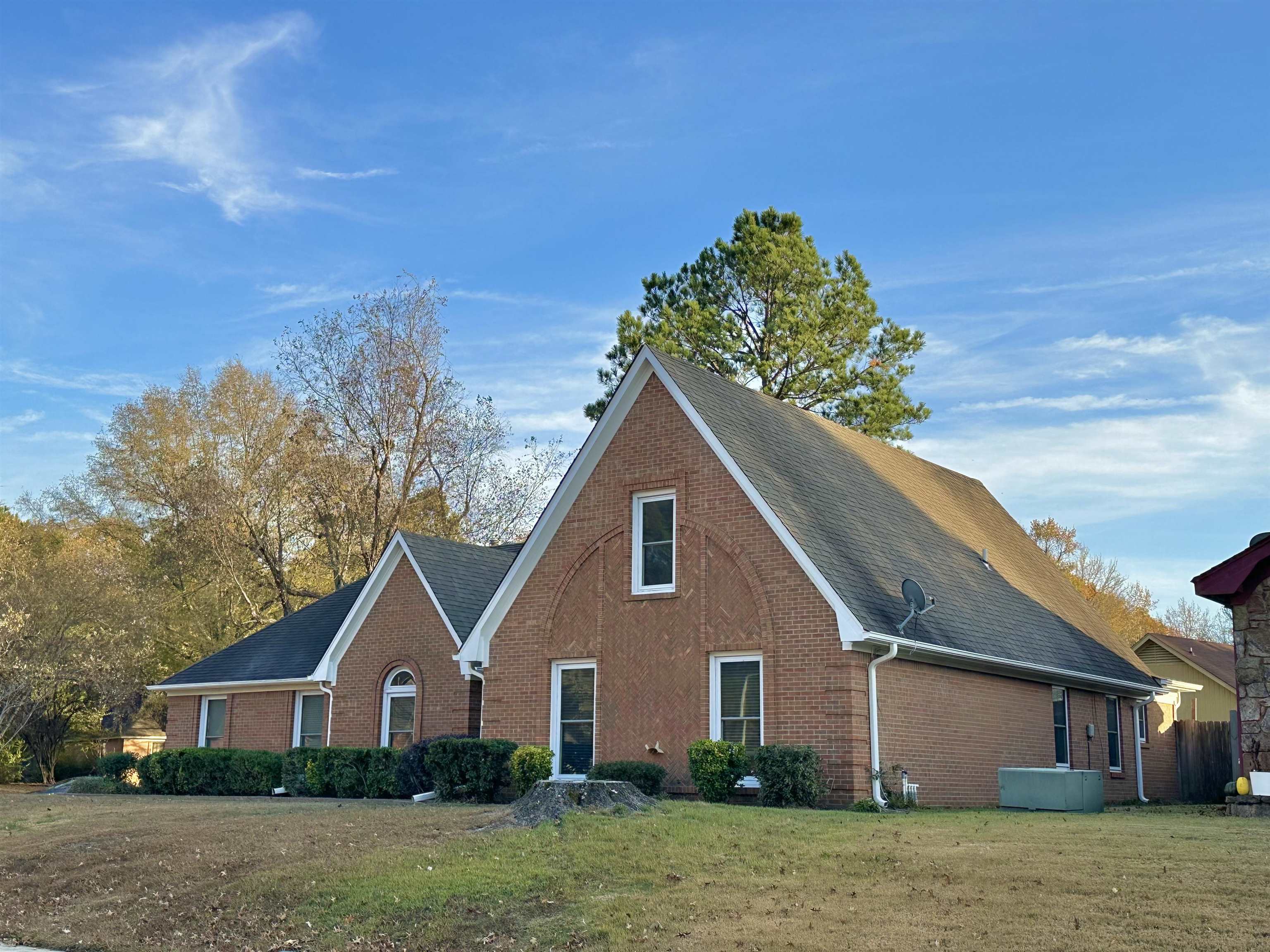 7475 Kingsland Drive Memphis, TN 38125 - Photo 28 of 32 a front view of a house with a yard