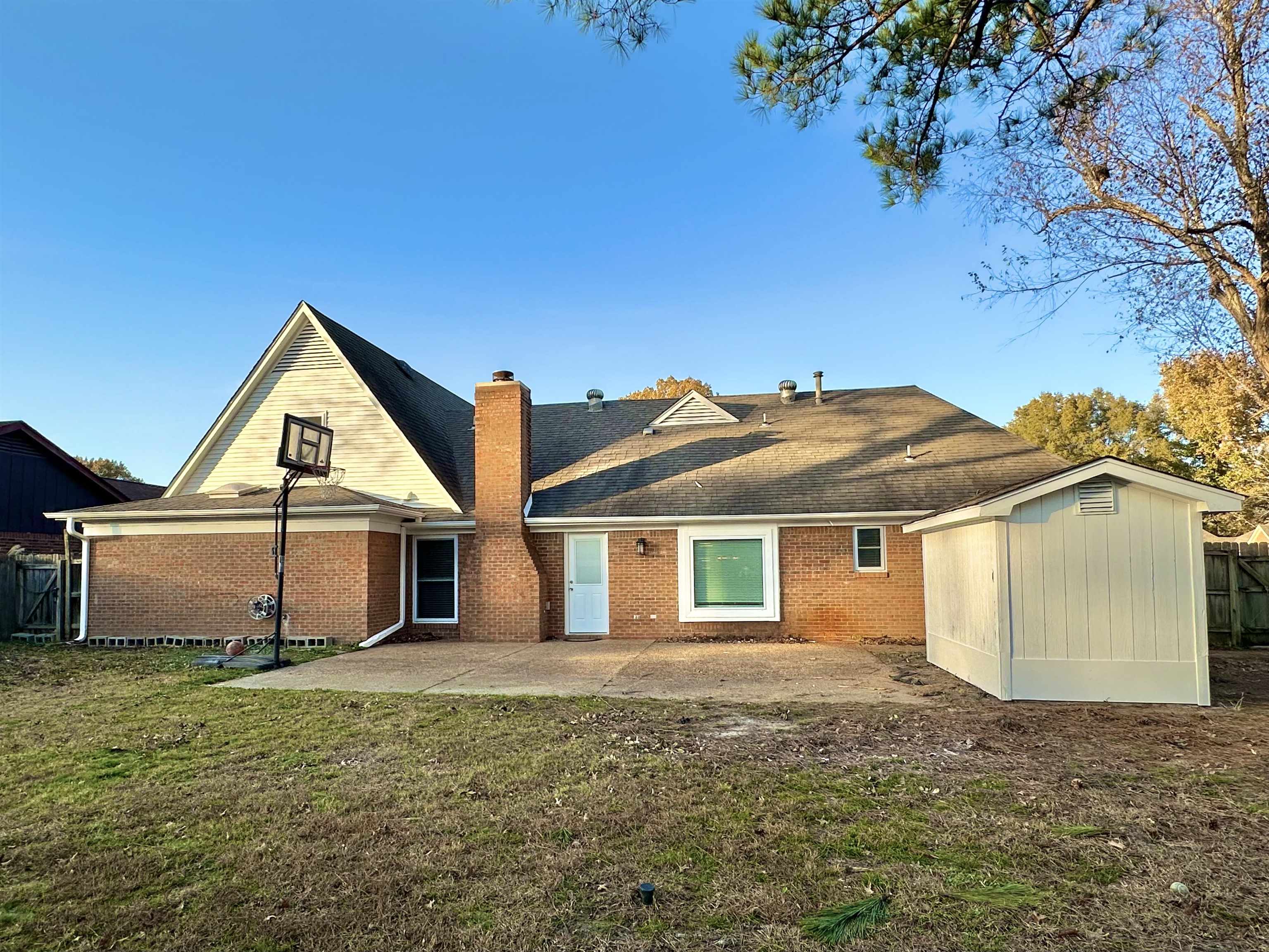 7475 Kingsland Drive Memphis, TN 38125 - Photo 31 of 32 a view of a yard in front of a house with a large tree
