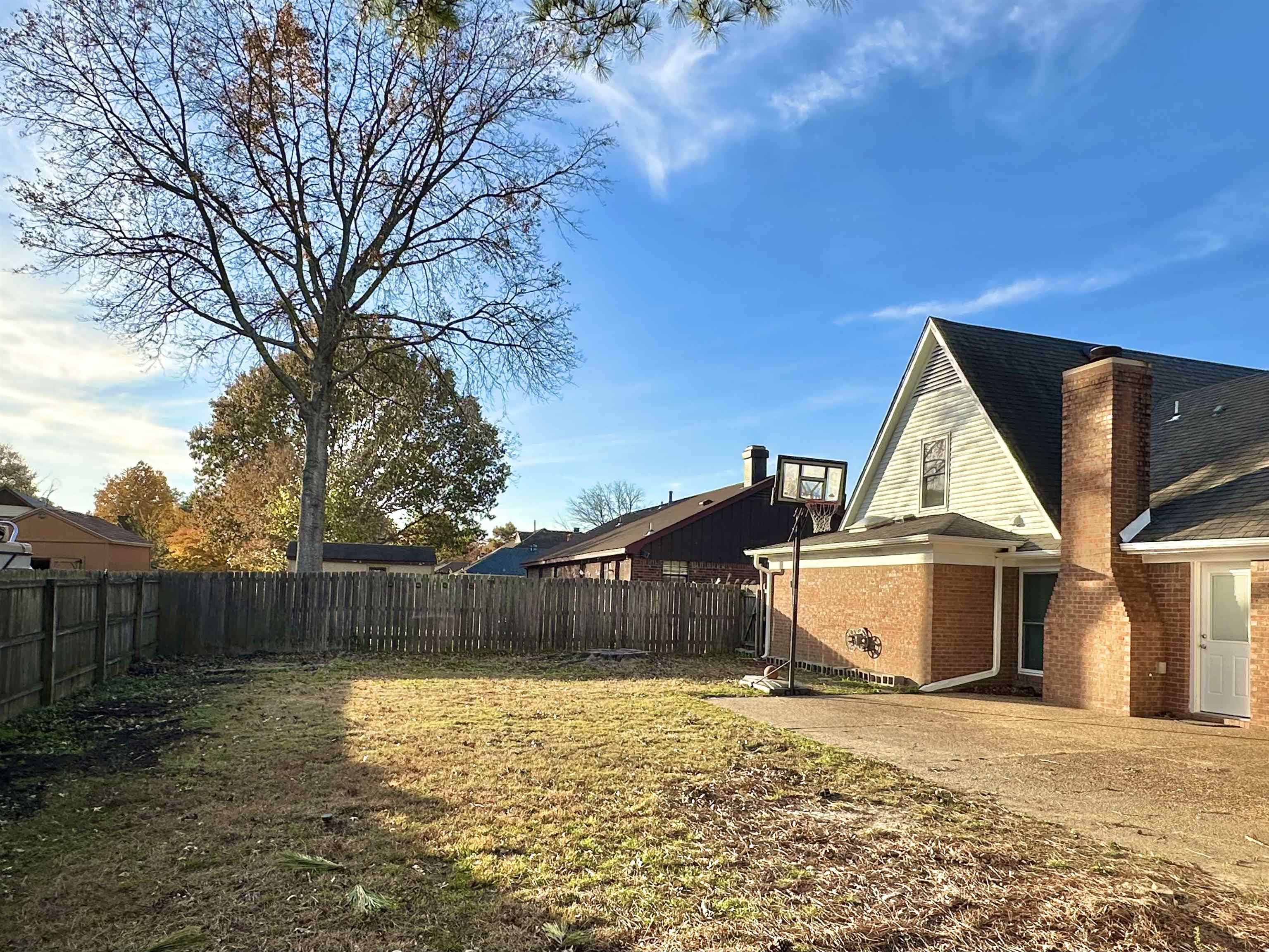 7475 Kingsland Drive Memphis, TN 38125 - Photo 32 of 32 a view of a house with a yard