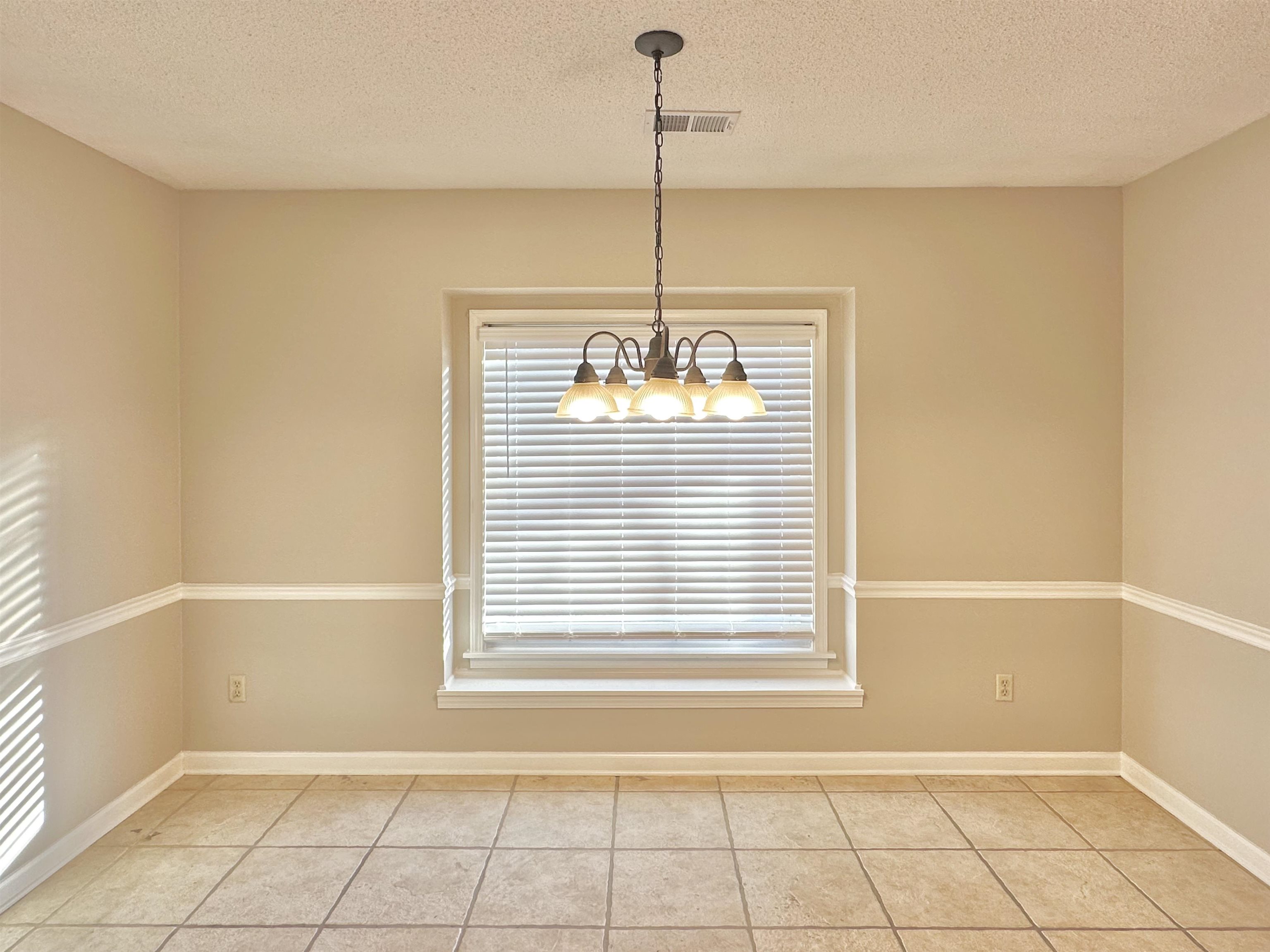 7475 Kingsland Drive Memphis, TN 38125 - Photo 8 of 32 a view of an empty room and window