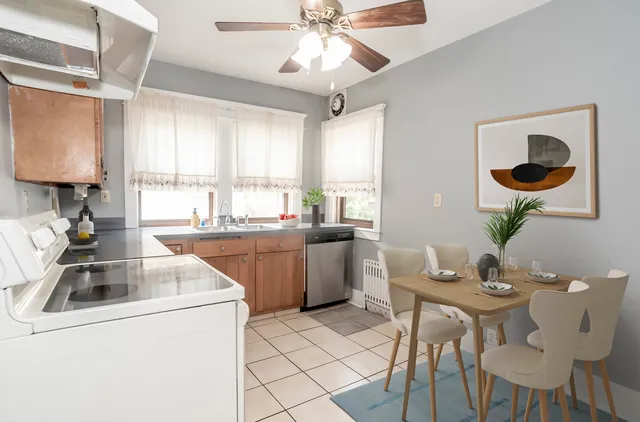 a kitchen with a sink cabinets and window