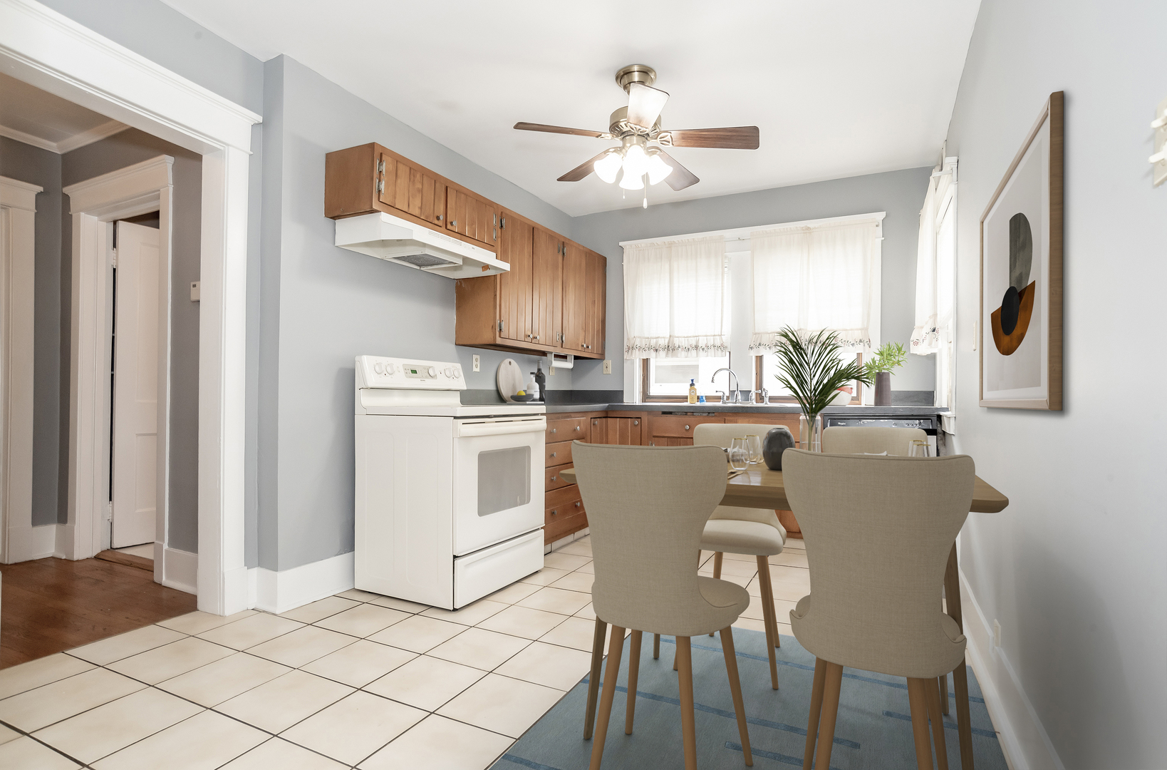 24 North Madison Avenue, Unit 2 La Grange, IL 60525 - Photo 6 of 14 a dining room with furniture a kitchen a sink and a chandelier