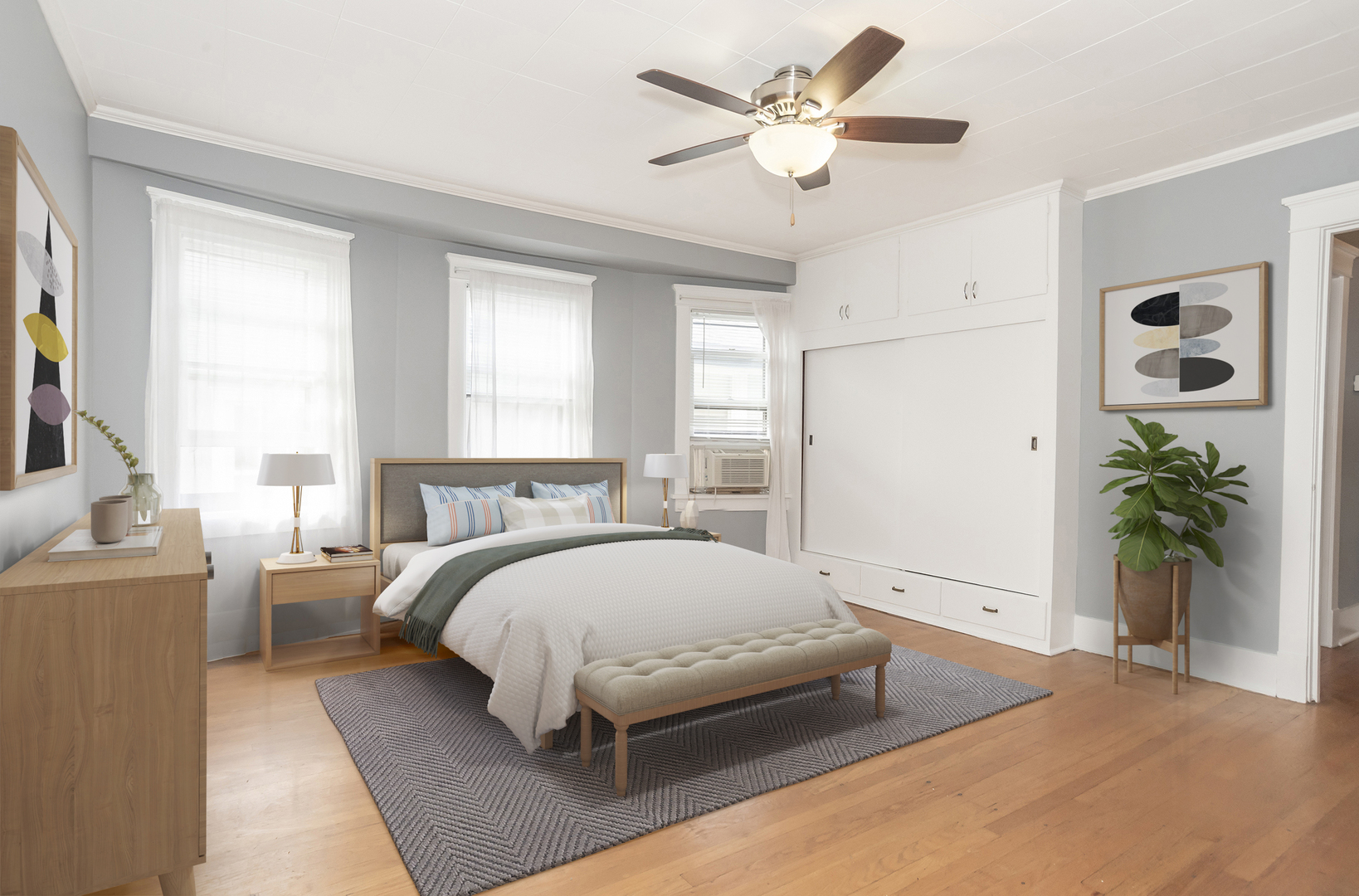 24 North Madison Avenue, Unit 2 La Grange, IL 60525 - Photo 7 of 14 a spacious bedroom with a large bed and a chandelier