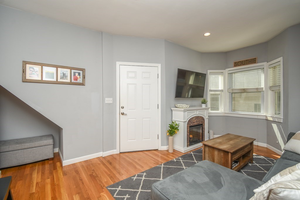 266 Bowen Street, Unit 1 Boston, MA 02127 - Photo 13 of 33 a bedroom with furniture and a window