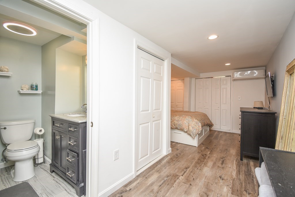 266 Bowen Street, Unit 1 Boston, MA 02127 - Photo 18 of 33 a spacious bathroom with a toilet and a tub