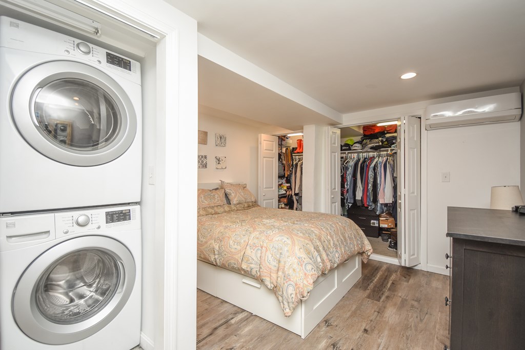 266 Bowen Street, Unit 1 Boston, MA 02127 - Photo 23 of 33 a view of a bedroom with washer and dryer