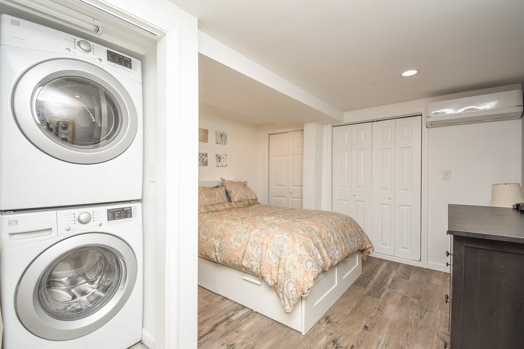 266 Bowen Street, Unit 1 Boston, MA 02127 - Photo 24 of 33 a bedroom with a sink and a washer dryer