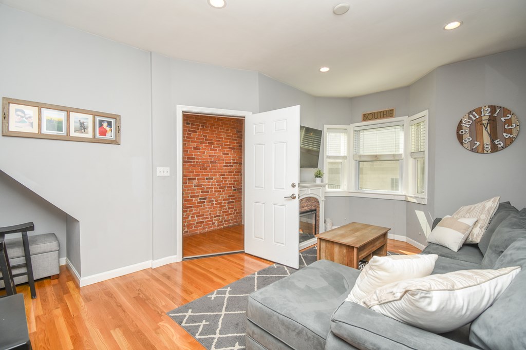 266 Bowen Street, Unit 1 Boston, MA 02127 - Photo 29 of 33 a living room with furniture and a window