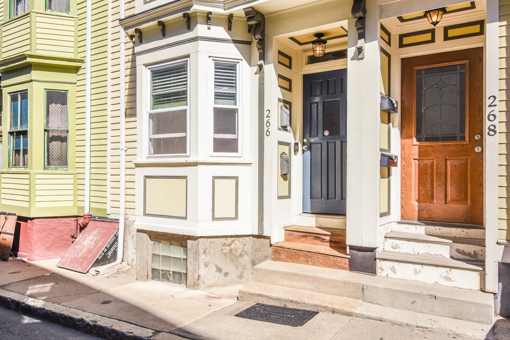266 Bowen Street, Unit 1 Boston, MA 02127 - Photo 30 of 33 front view of a house with a lounge chair