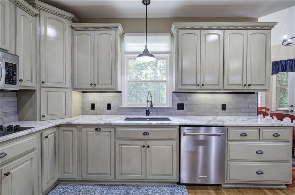 181 Fox Den Circle Jasper, GA 30143 - Photo 23 of 111 a kitchen with cabinets appliances and a window
