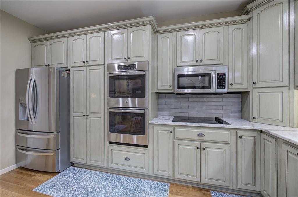 181 Fox Den Circle Jasper, GA 30143 - Photo 25 of 111 a kitchen with stainless steel appliances granite countertop a refrigerator and cabinets