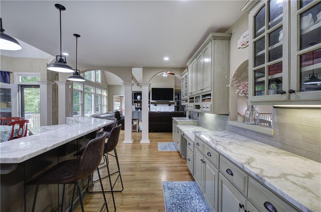 181 Fox Den Circle Jasper, GA 30143 - Photo 26 of 111 a large kitchen with granite countertop lots of counter space and a sink