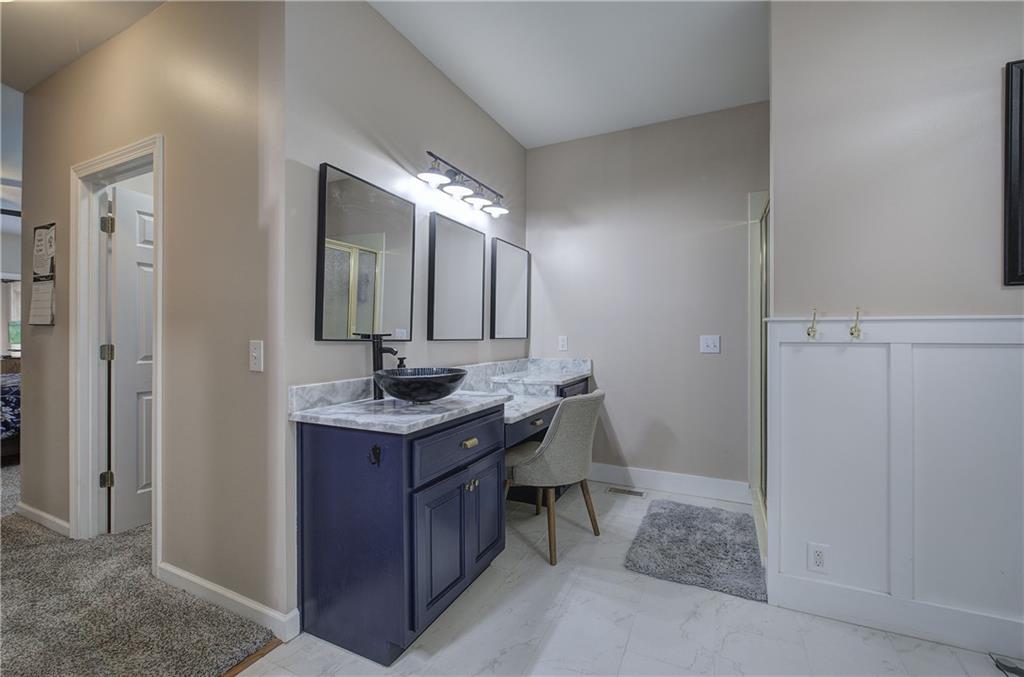 181 Fox Den Circle Jasper, GA 30143 - Photo 35 of 111 a bathroom with a granite countertop sink a mirror and a vanity