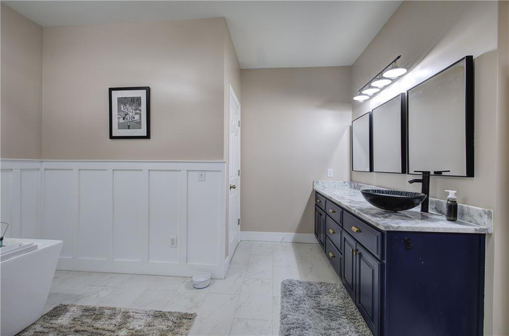 181 Fox Den Circle Jasper, GA 30143 - Photo 38 of 111 a bathroom with a granite countertop sink a mirror and bathtub