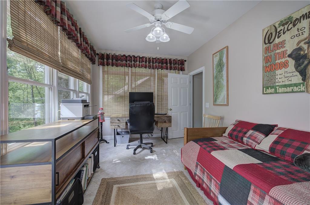 181 Fox Den Circle Jasper, GA 30143 - Photo 40 of 111 a bedroom with a bed and a large window