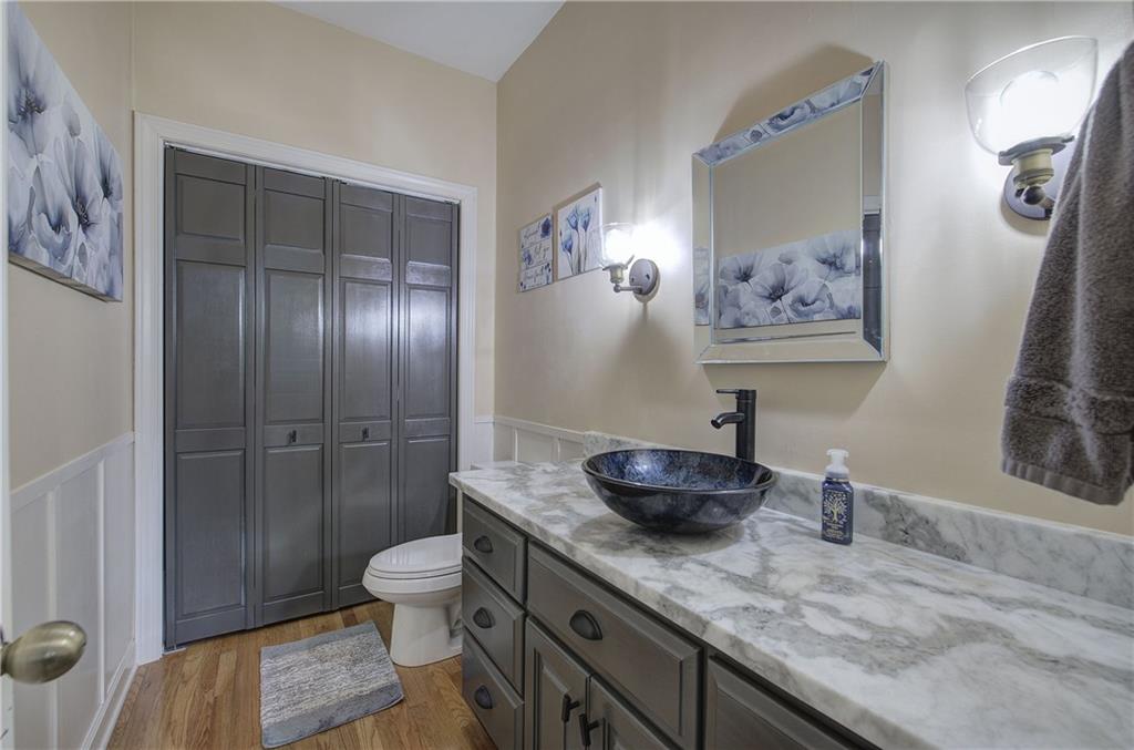 181 Fox Den Circle Jasper, GA 30143 - Photo 42 of 111 a bathroom with a granite countertop sink a toilet and a shower