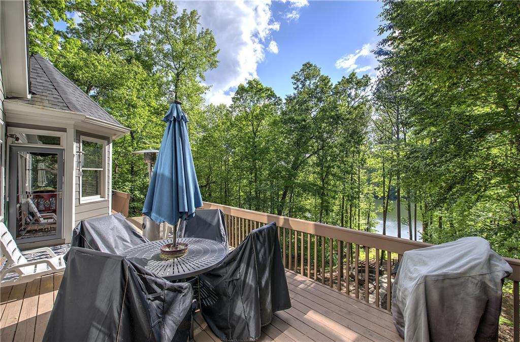 181 Fox Den Circle Jasper, GA 30143 - Photo 45 of 111 a view of a patio with a table chairs and a small yard