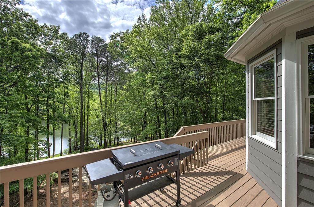 181 Fox Den Circle Jasper, GA 30143 - Photo 49 of 111 a view of balcony with wooden floor and outdoor seating