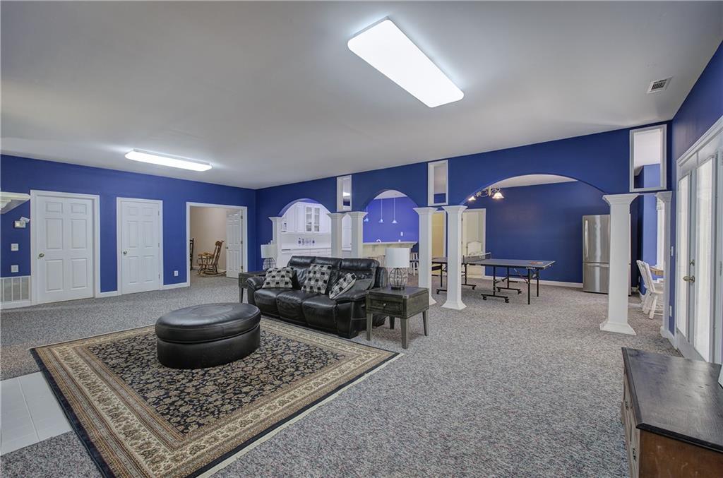 181 Fox Den Circle Jasper, GA 30143 - Photo 53 of 111 a living room with furniture and a rug