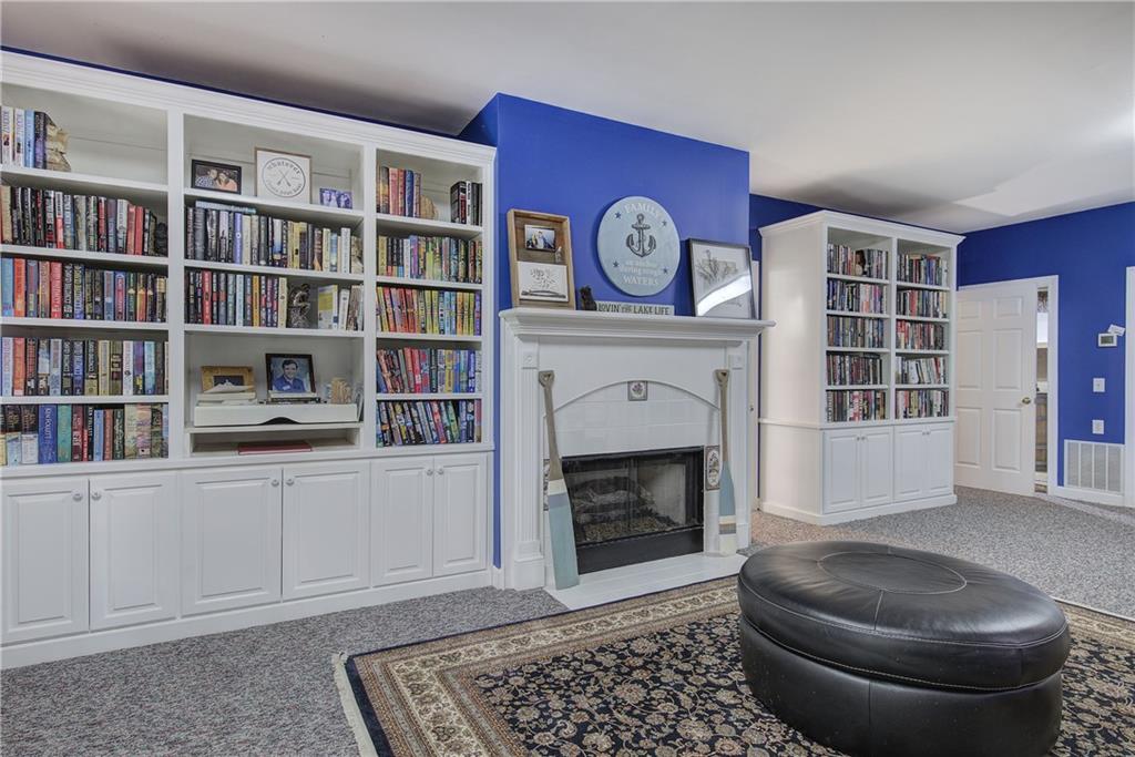 181 Fox Den Circle Jasper, GA 30143 - Photo 55 of 111 a living room with furniture and a fireplace