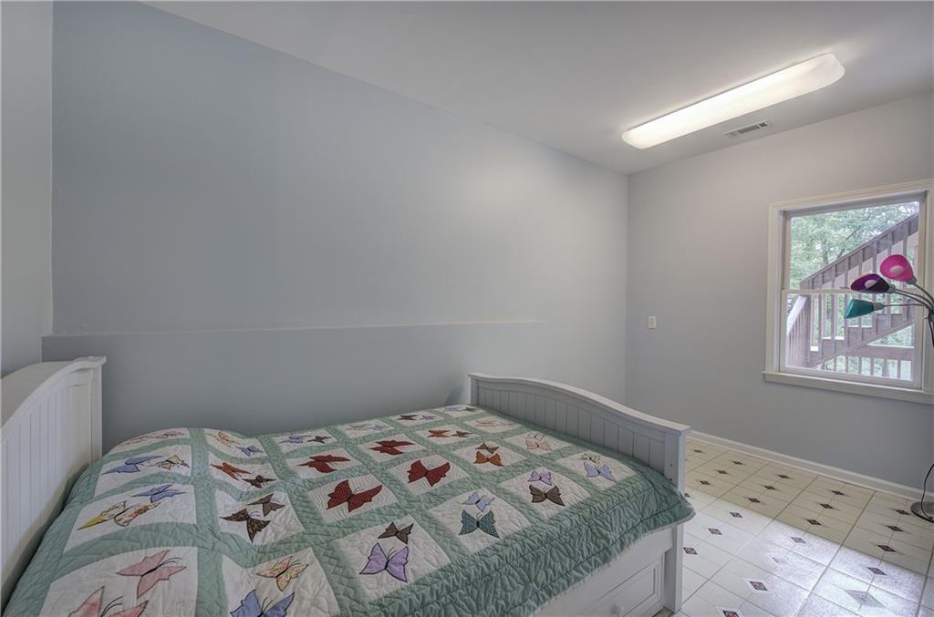 181 Fox Den Circle Jasper, GA 30143 - Photo 65 of 111 a bedroom with a bed and a window
