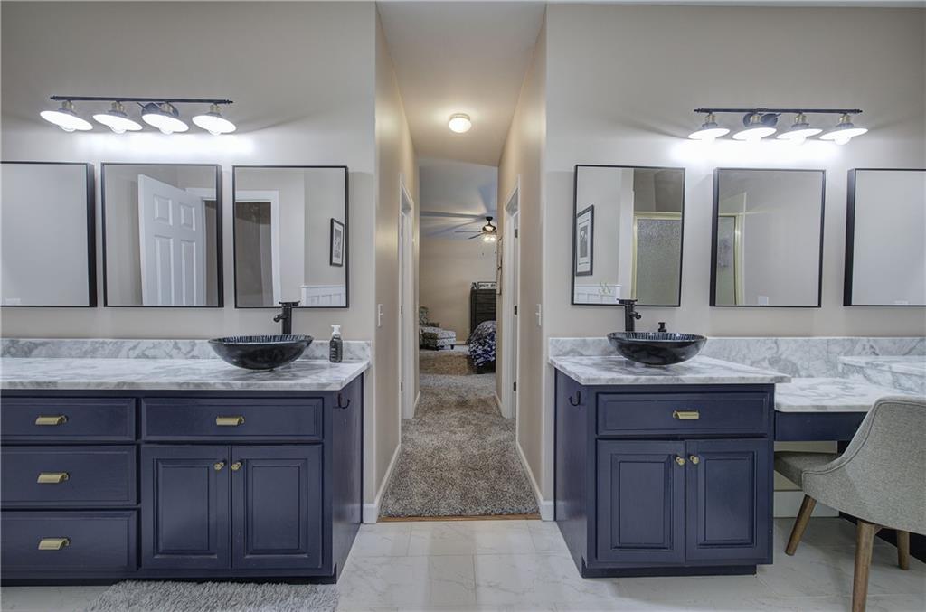 181 Fox Den Circle Jasper, GA 30143 - Photo 10 of 111 a bathroom with a granite countertop sink a mirror and a vanity