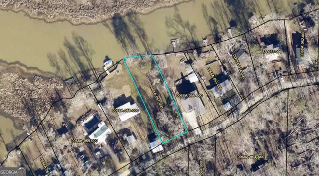 a view of a street with houses on the roadside