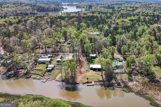 an aerial view of a houses with yard