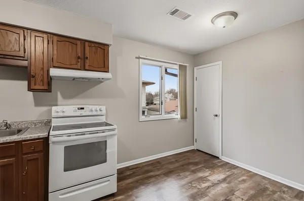 a kitchen with a stove and a microwave