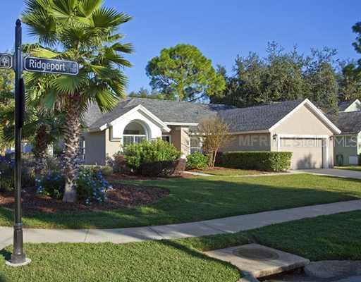 7202 Ridgeport Drive Tampa, FL 33647 - Photo 1 of 1 a front view of a house with garden