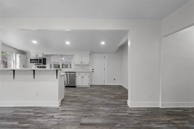 a view of kitchen with wooden floor