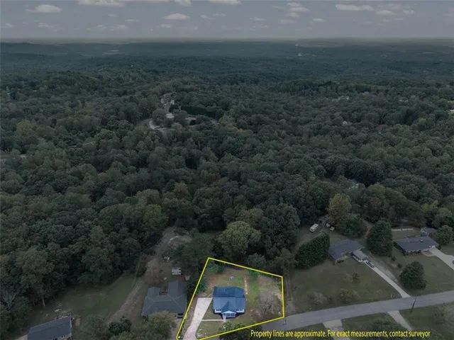 an aerial view of residential house with outdoor space