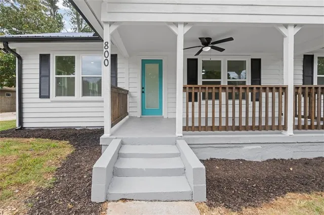 a front view of a house with a porch