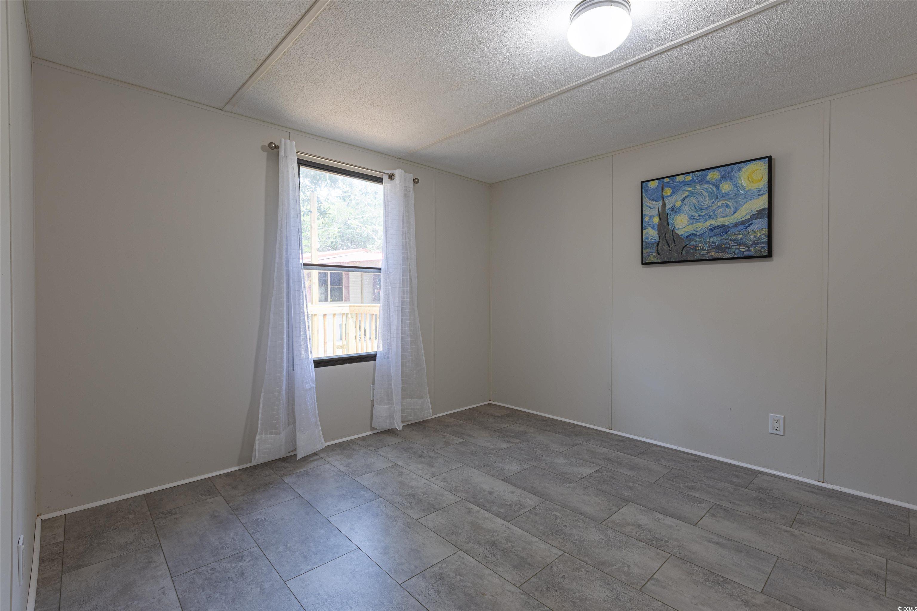 327 Ross Lane Murrells Inlet, SC 29576 - Photo 23 of 28 Spare room featuring a textured ceiling